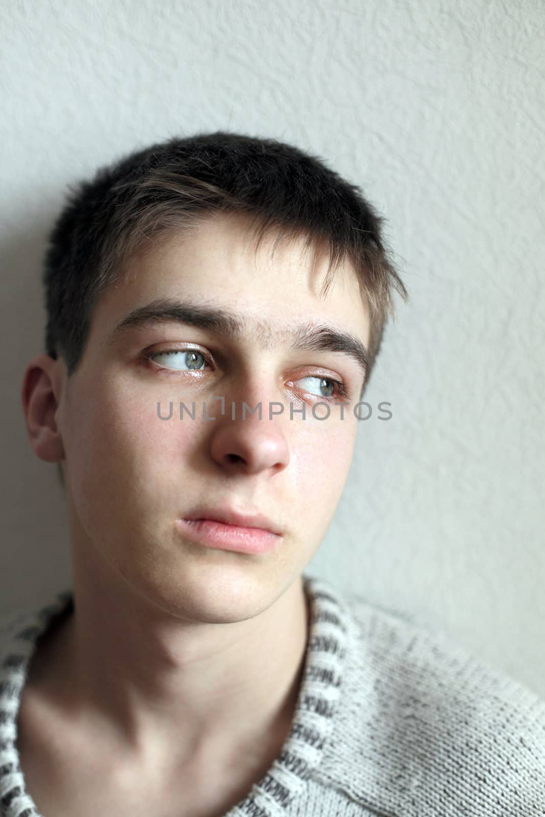 sad young man portrait in home