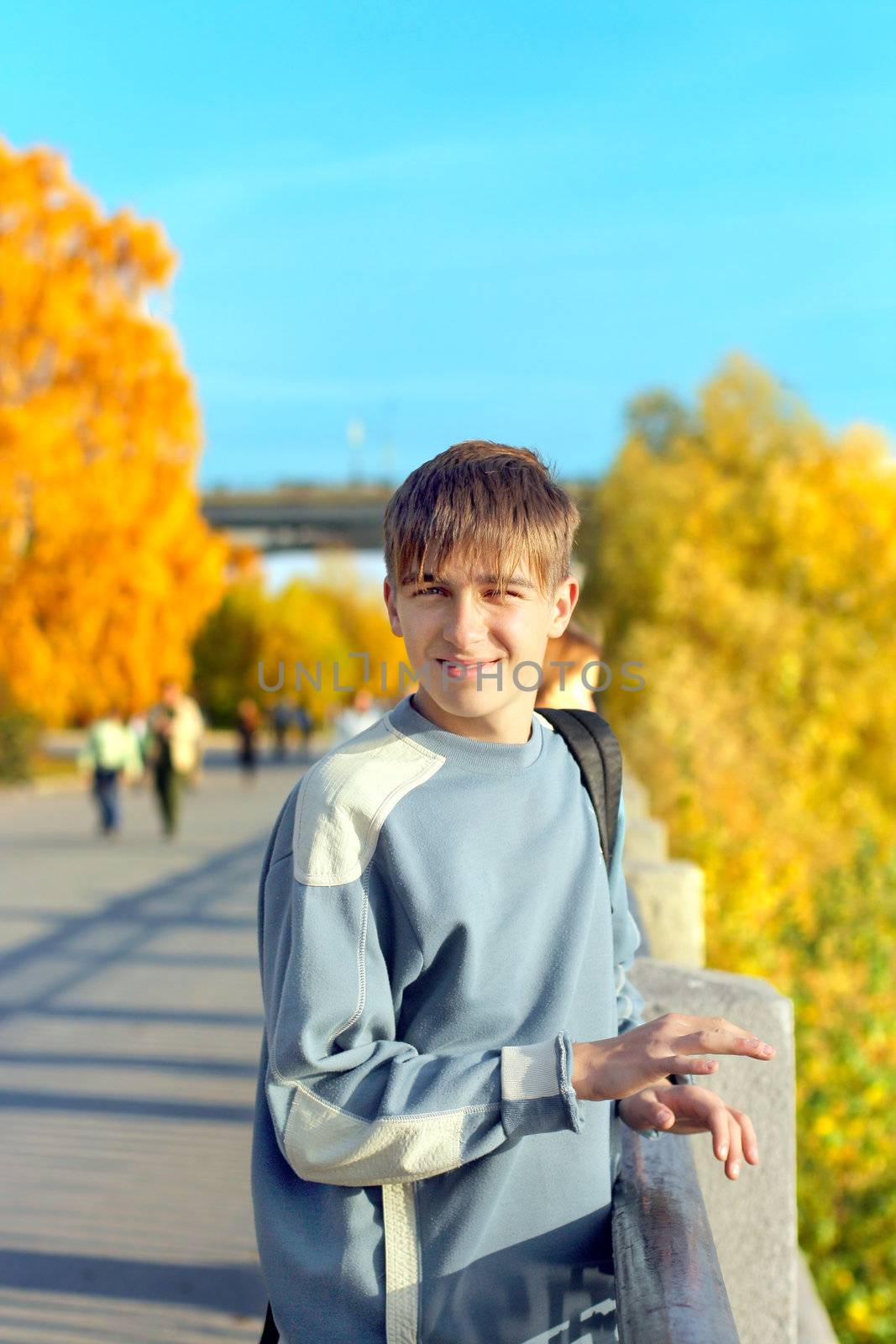 smiling teenager standing on the street