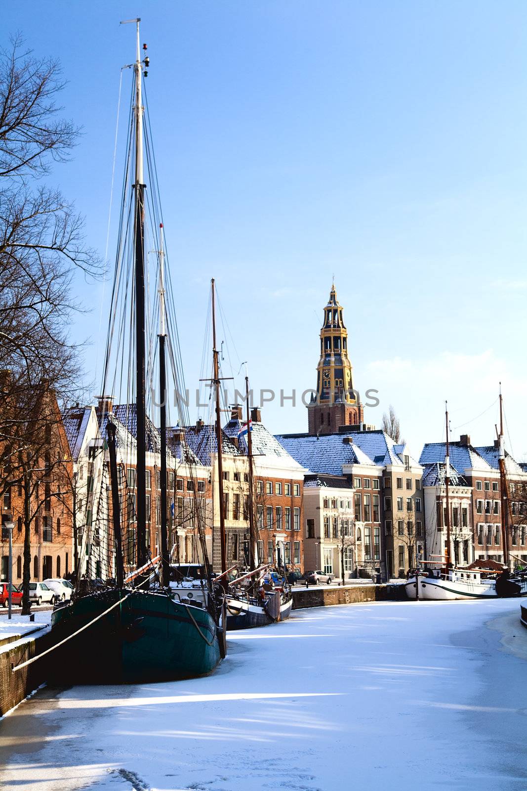 view on the channel with ships in Groningen, Netherlands, during winter