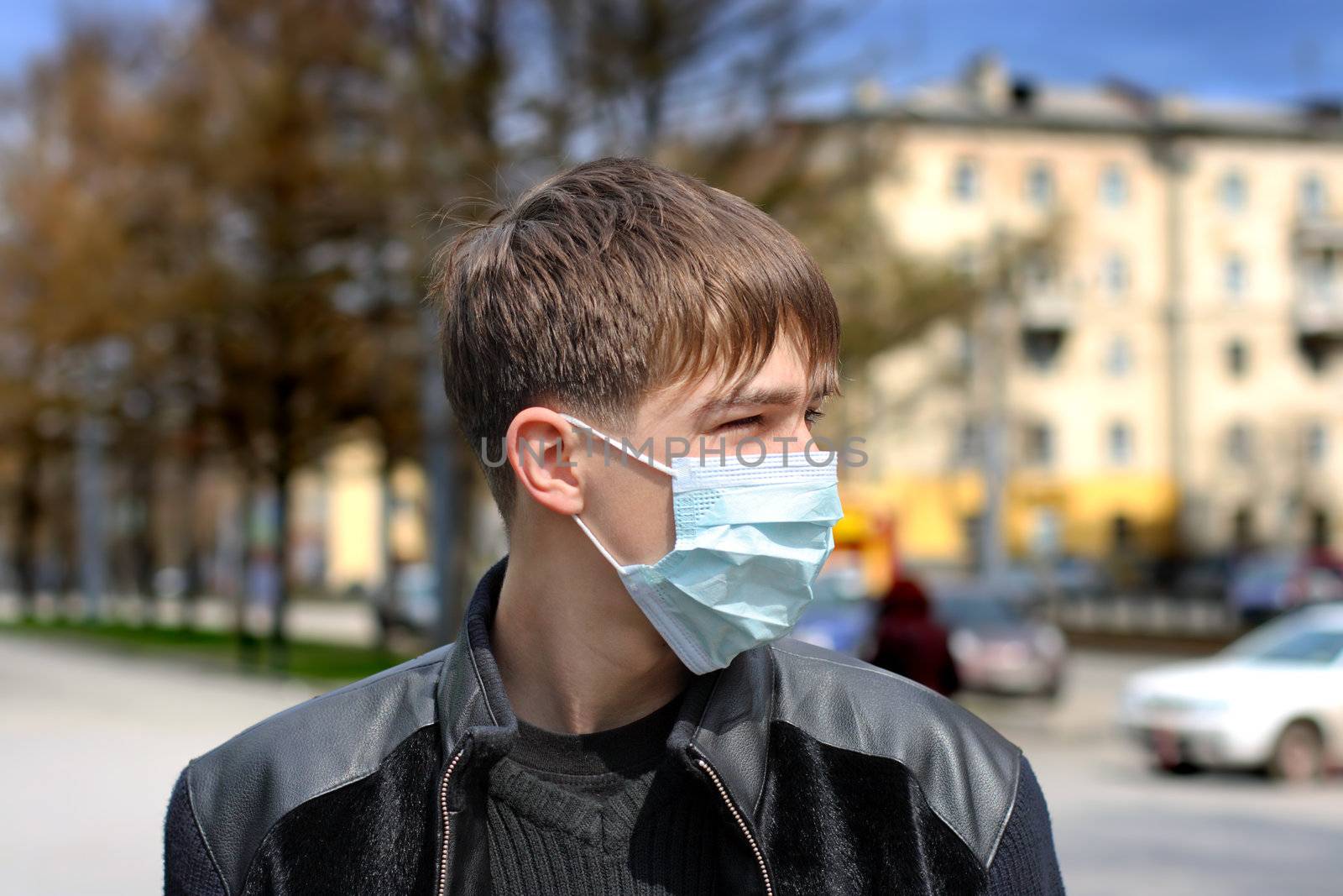 teenager in the flu mask on the street