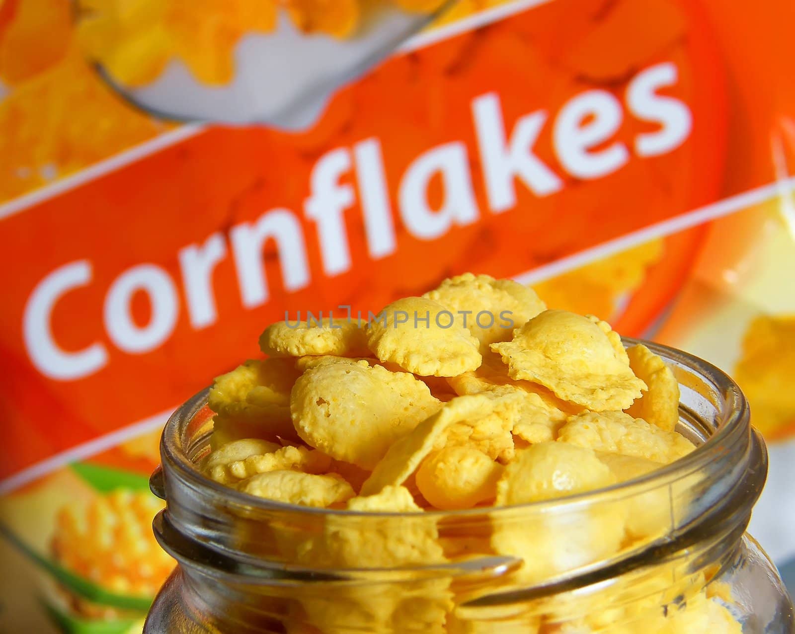 cornflakes jar closeup with bag blur background