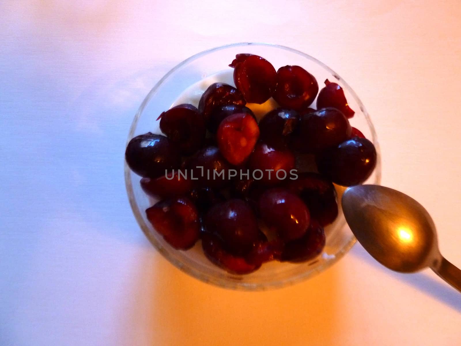 fresh cherries as desert on white background