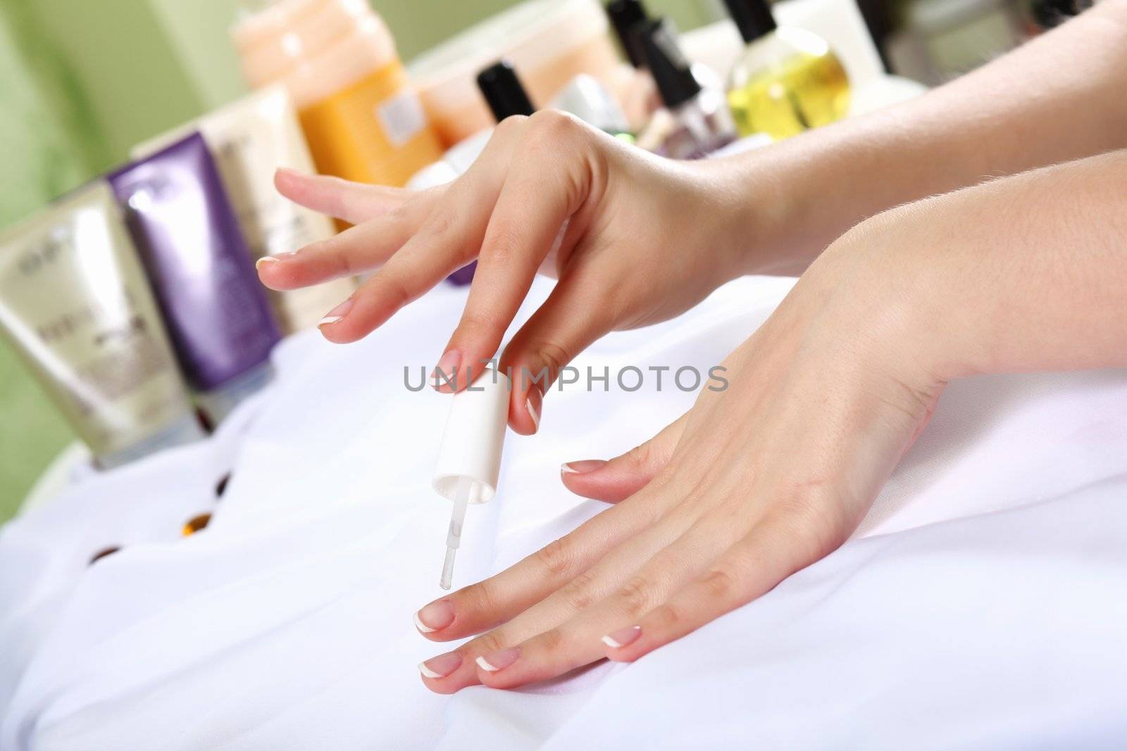 Female hands and manicure related objects in spa salon