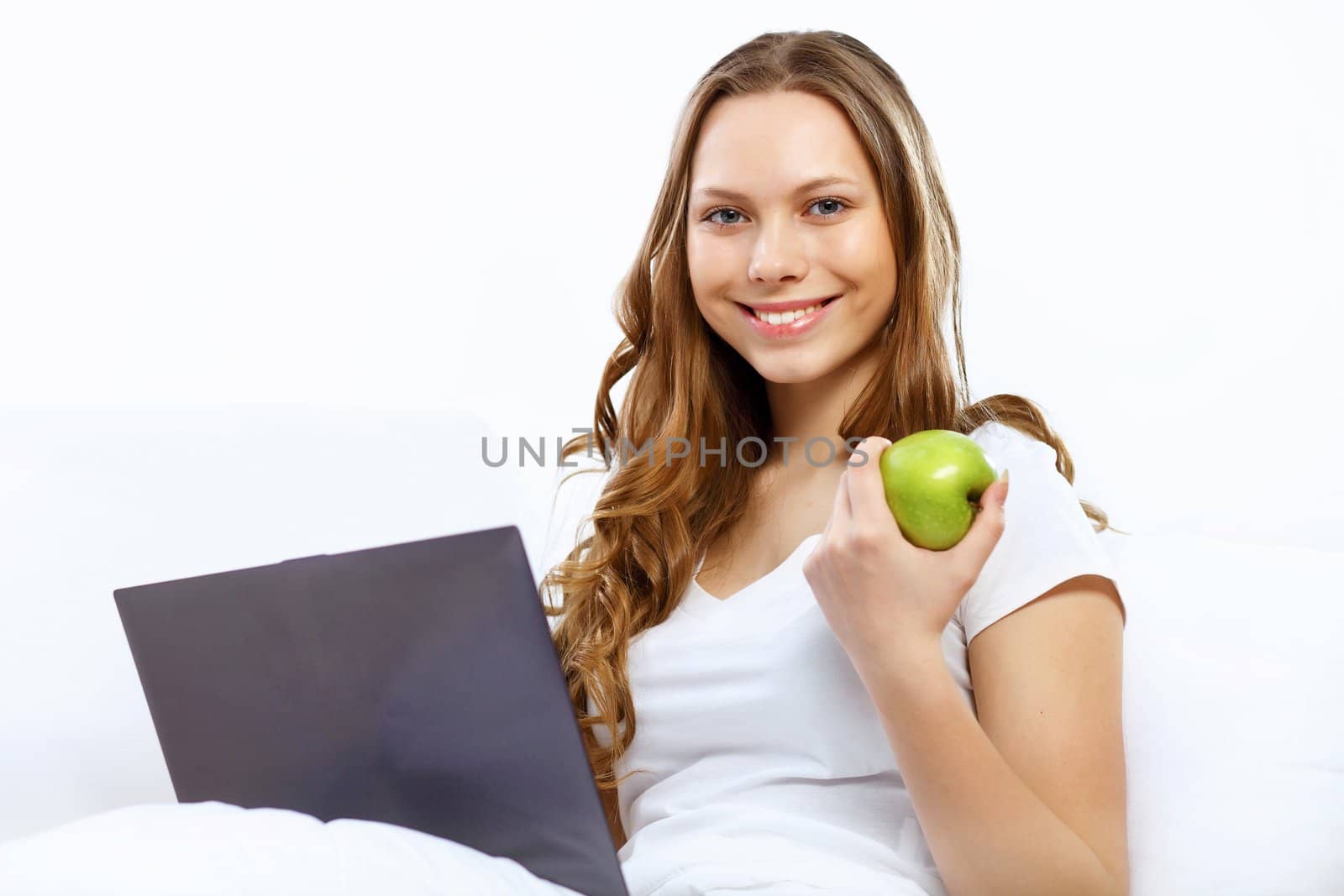 Portrait of young woman sitting with a notebook