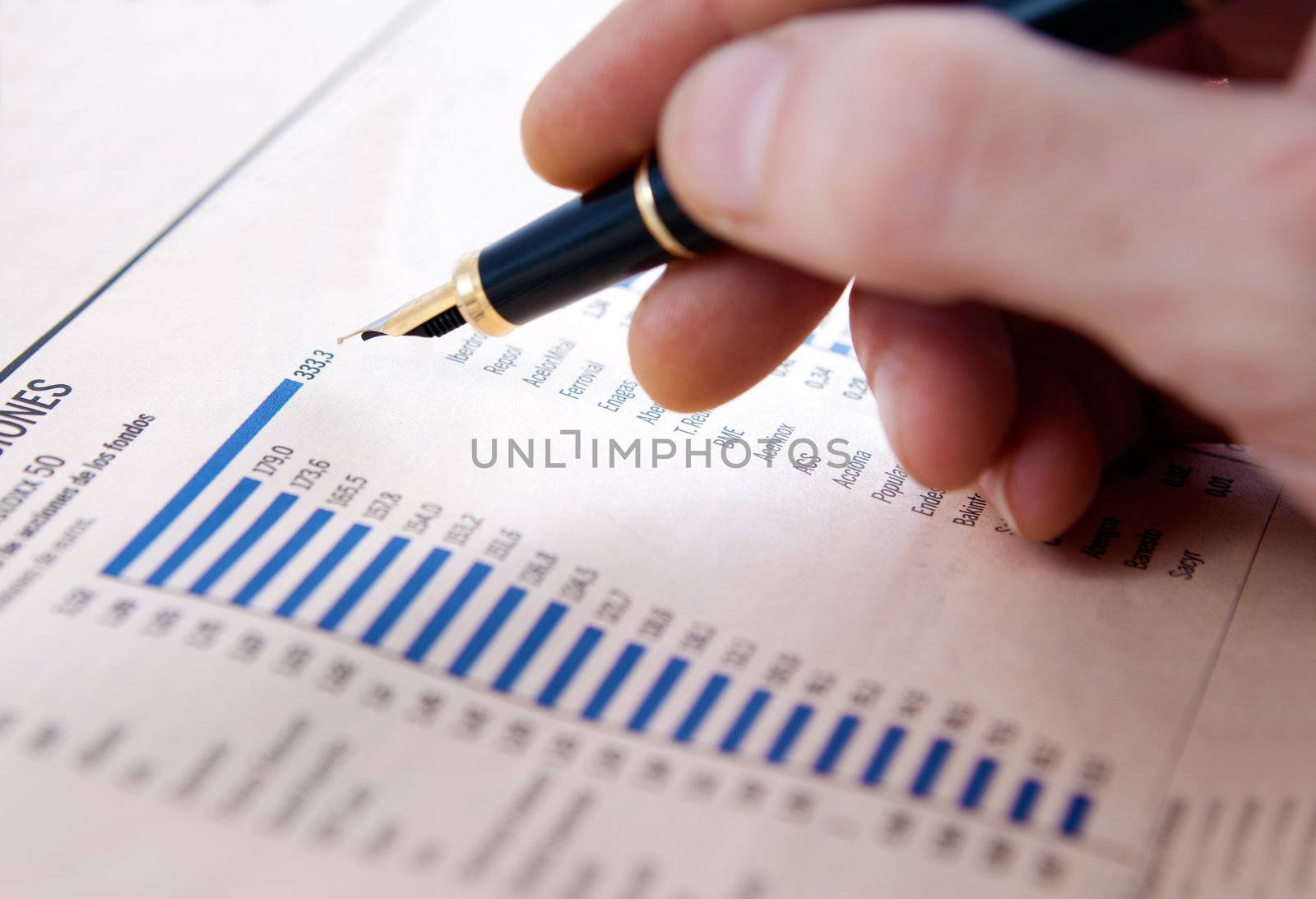Graphics and statistics with businessman's hand
