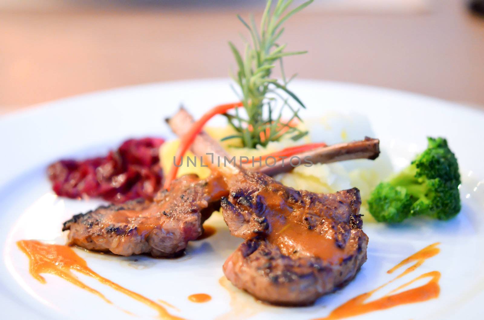Leg of lamb steak with sauce  and vegetables