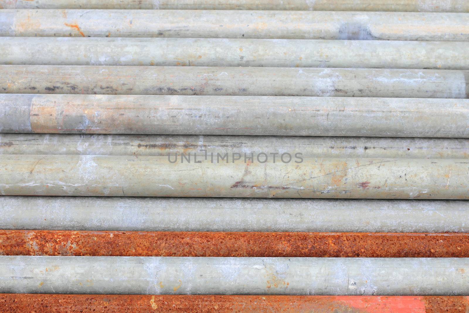 group of metal pipes on shelf 
 by rufous