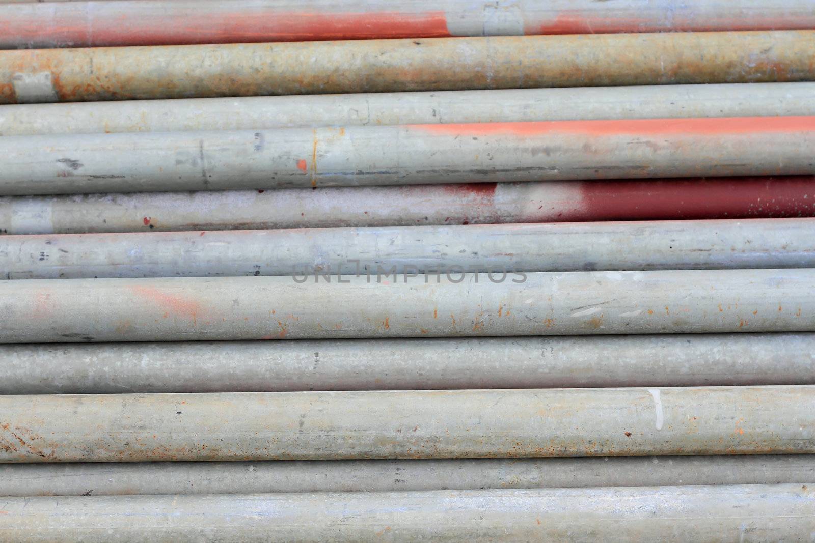 group of metal pipes on shelf