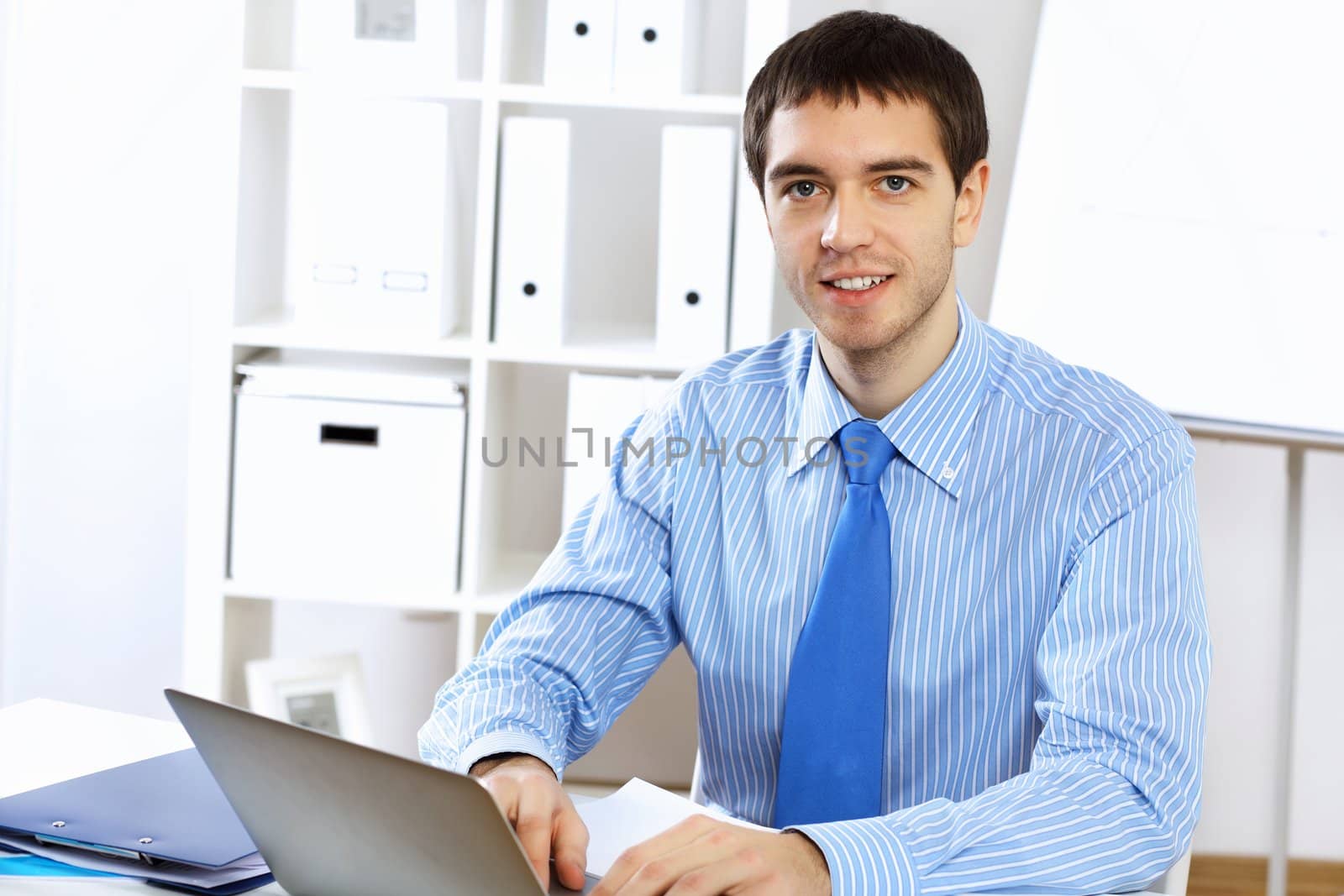Young and successful businessman in the office