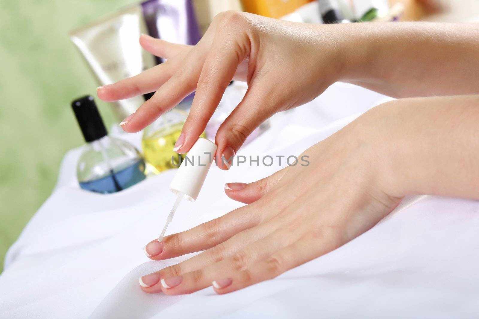 Female hands and manicure related objects in spa salon