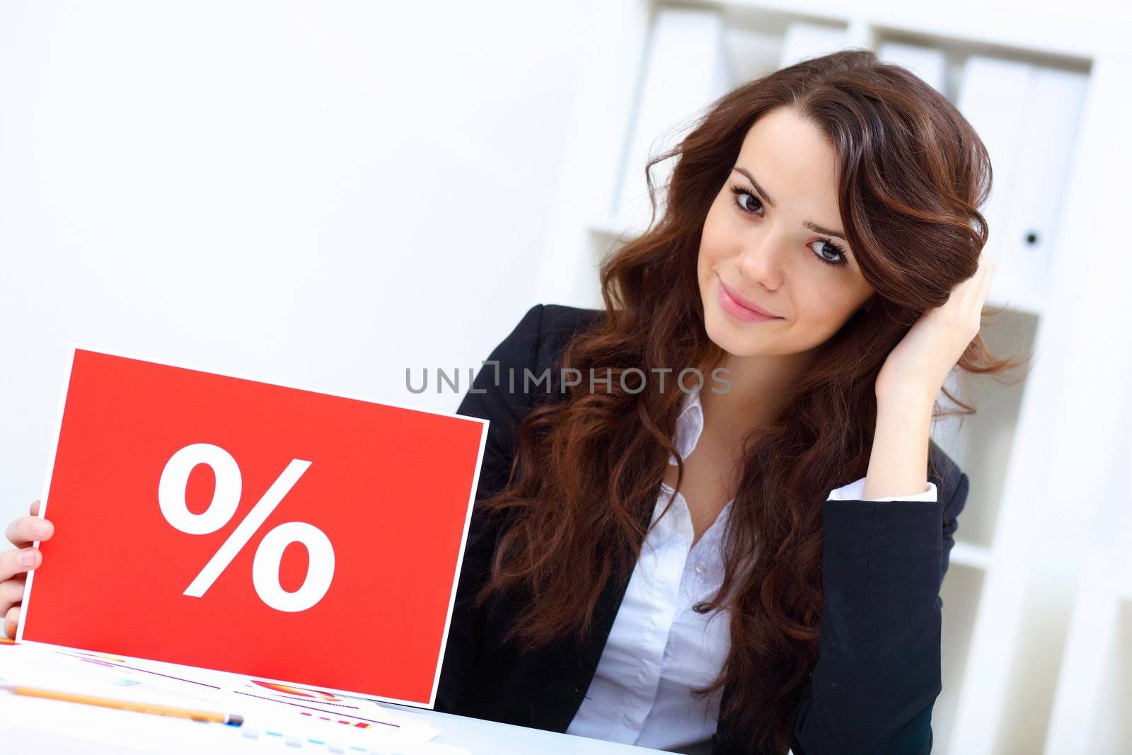 Young business woman with sale sign by sergey_nivens