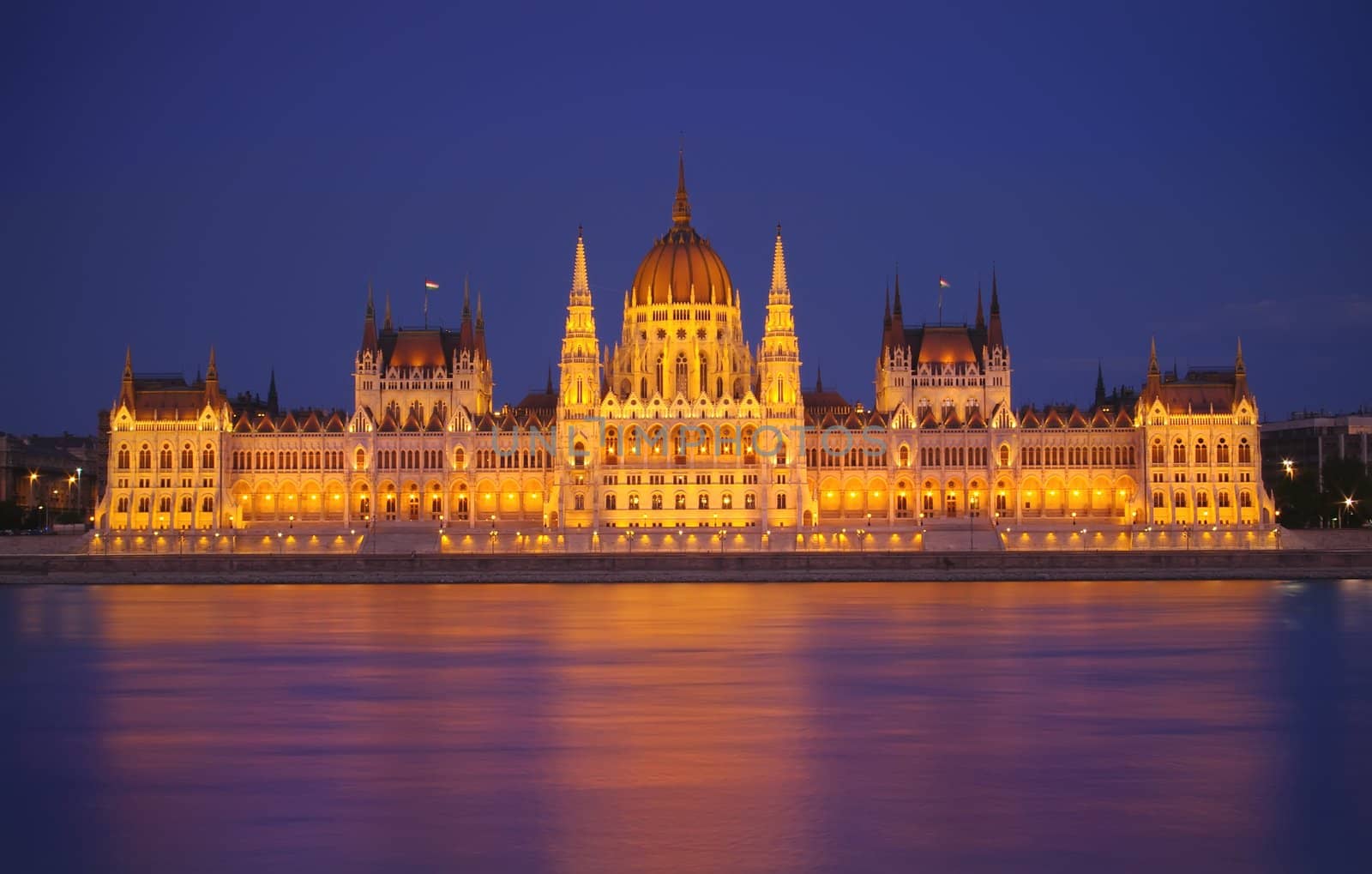 Budapest Parliament at night with reflection in Danube river 