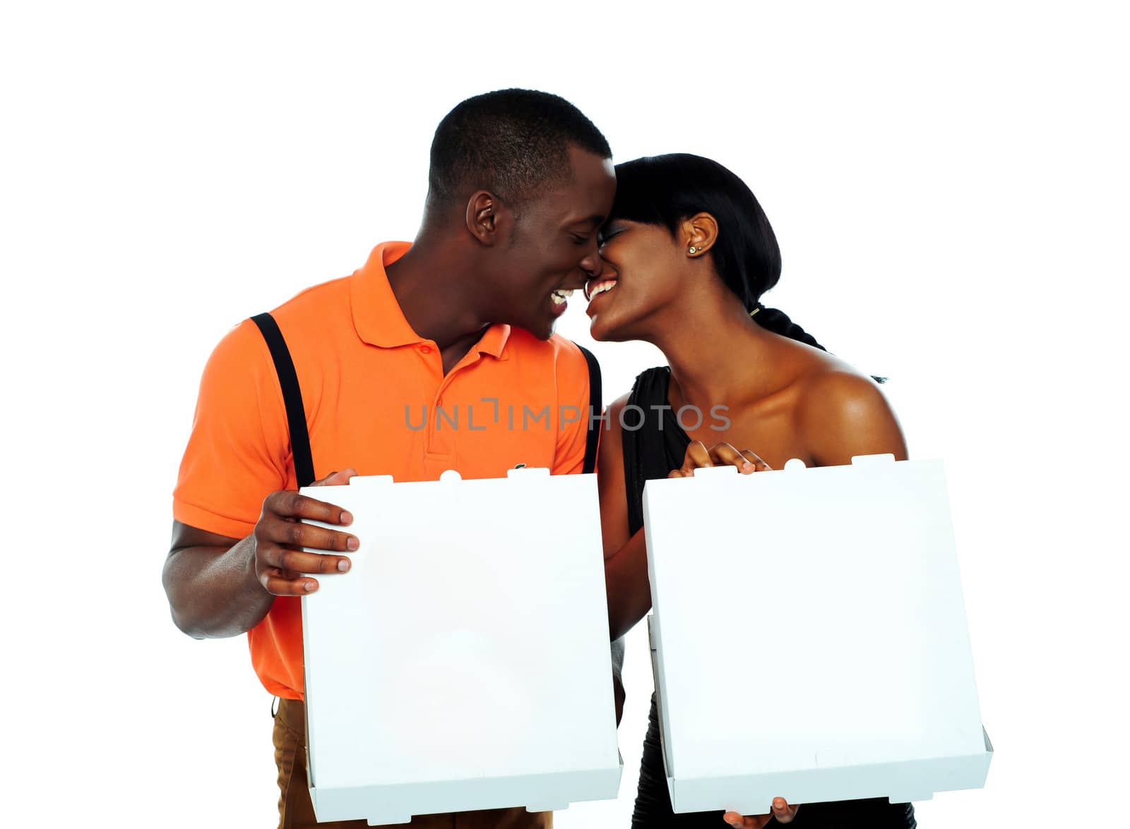 Black couple kissing and holding pizza boxes isolated over white background