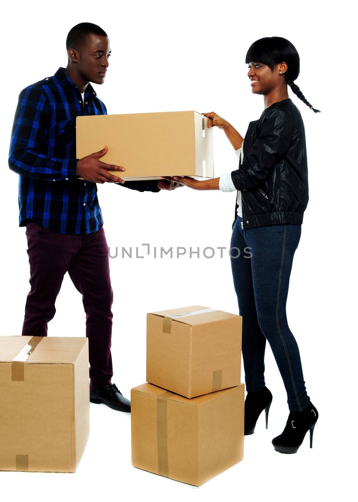 An isolated shot of couple moving empty cartons to new place