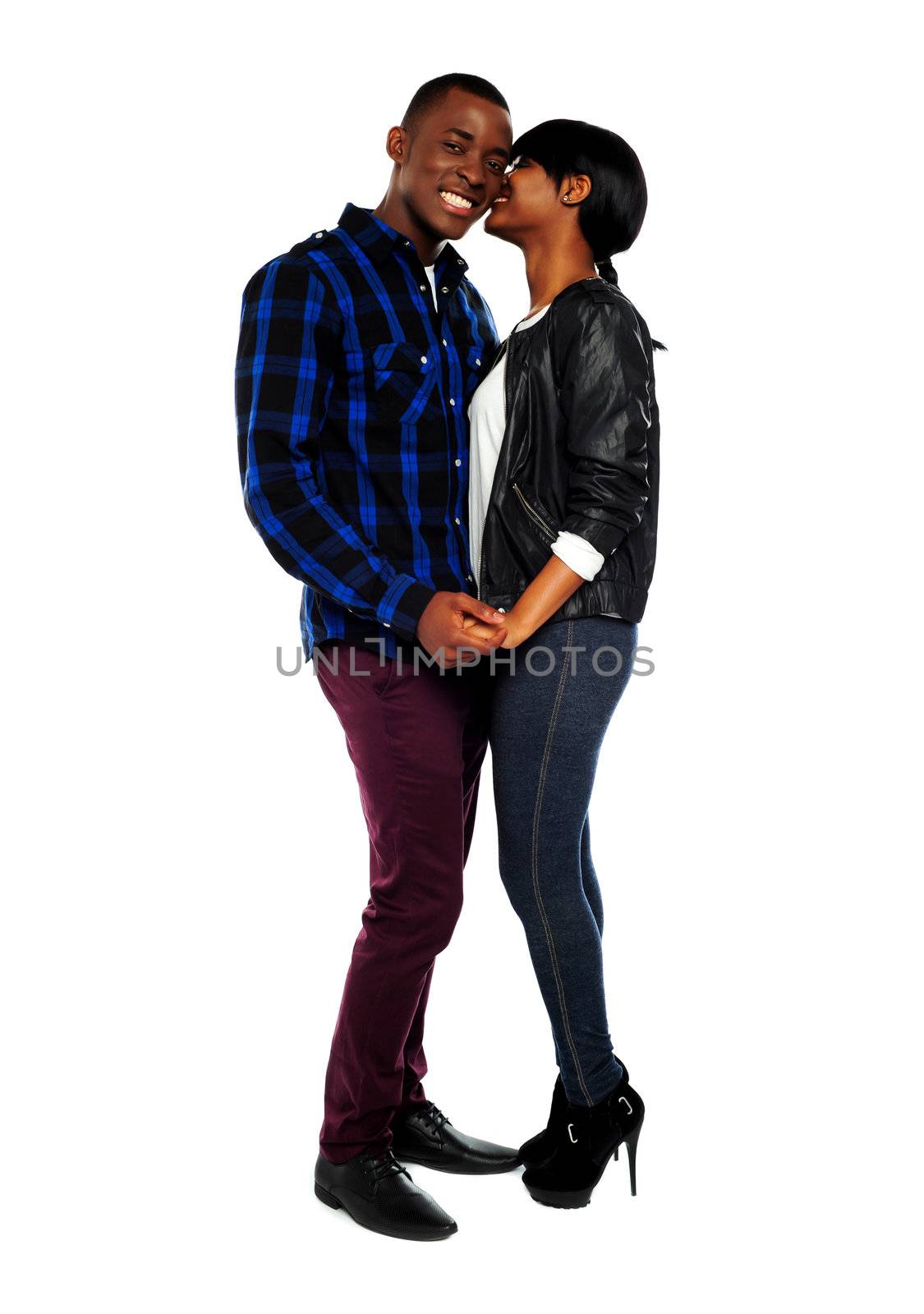 Attractive teenagers gossiping. Full length portrait over isolated white background