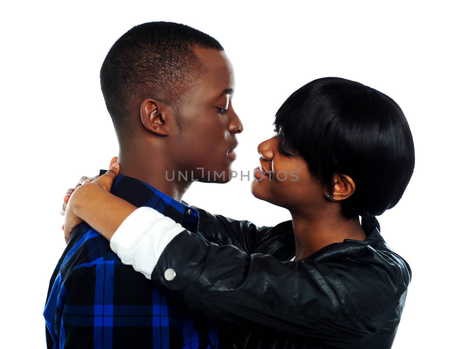 Young affectionate couple hugging by stockyimages