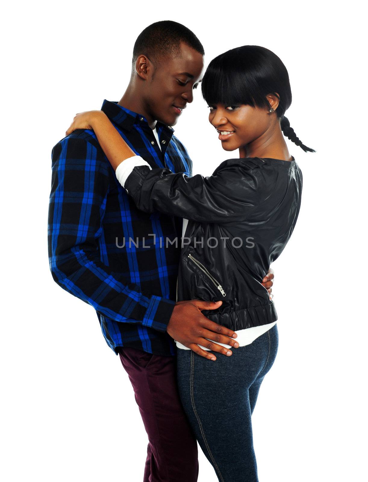 Young couple dancing over white background