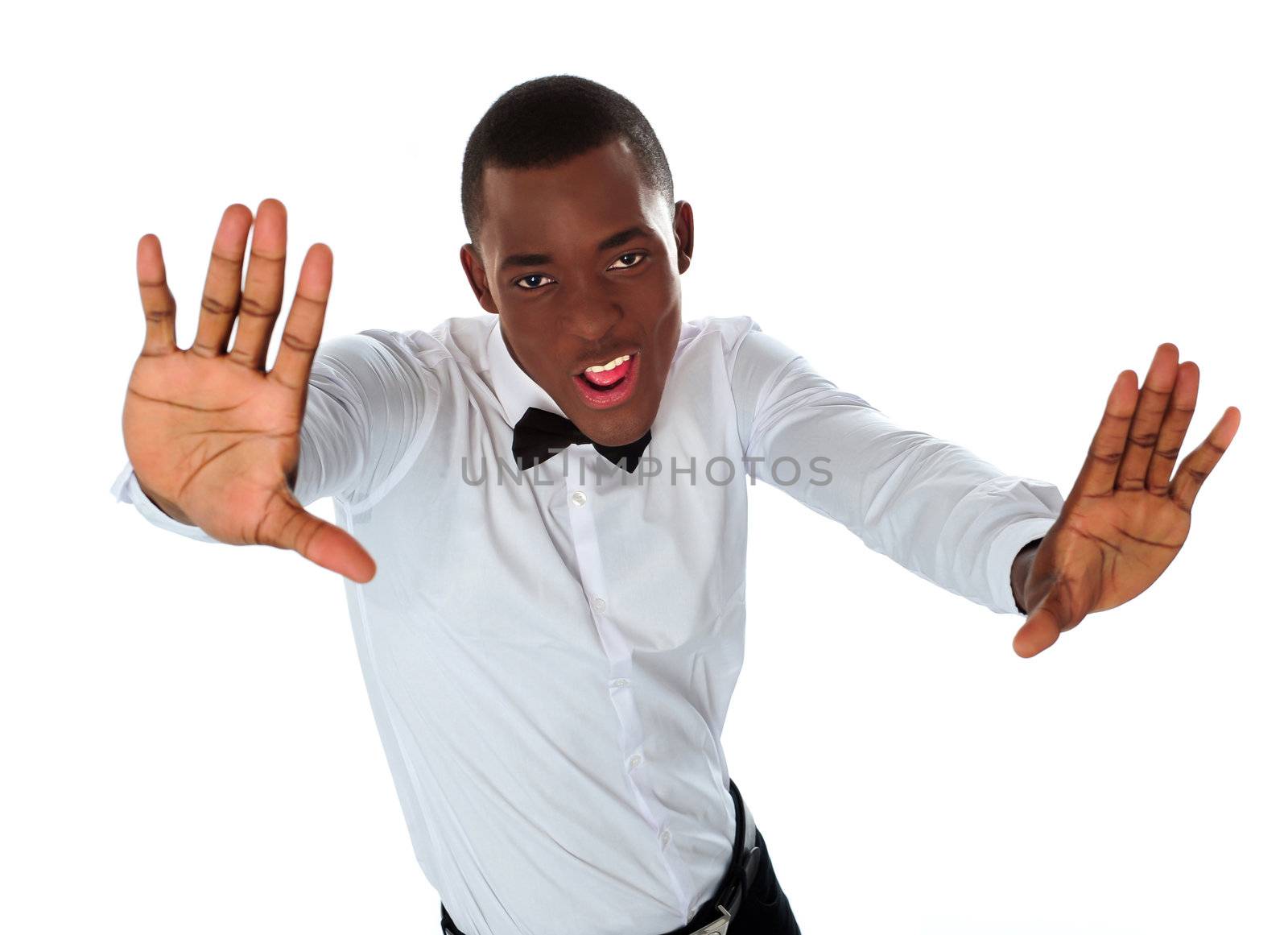 Happy stylish black man stretching to camera against white background