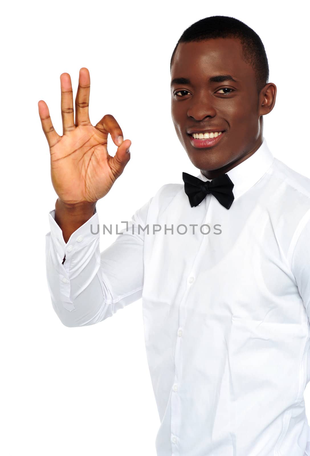 Young african boy showing okay gesture to camera