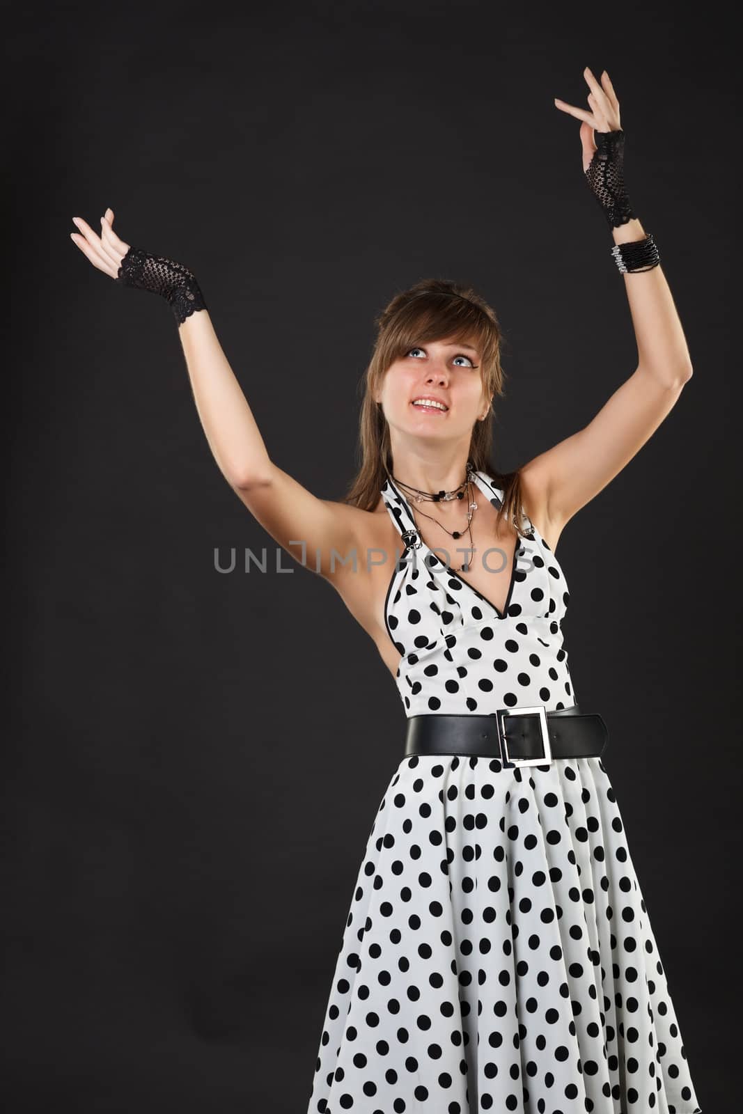 Young dancer woman in white dress.