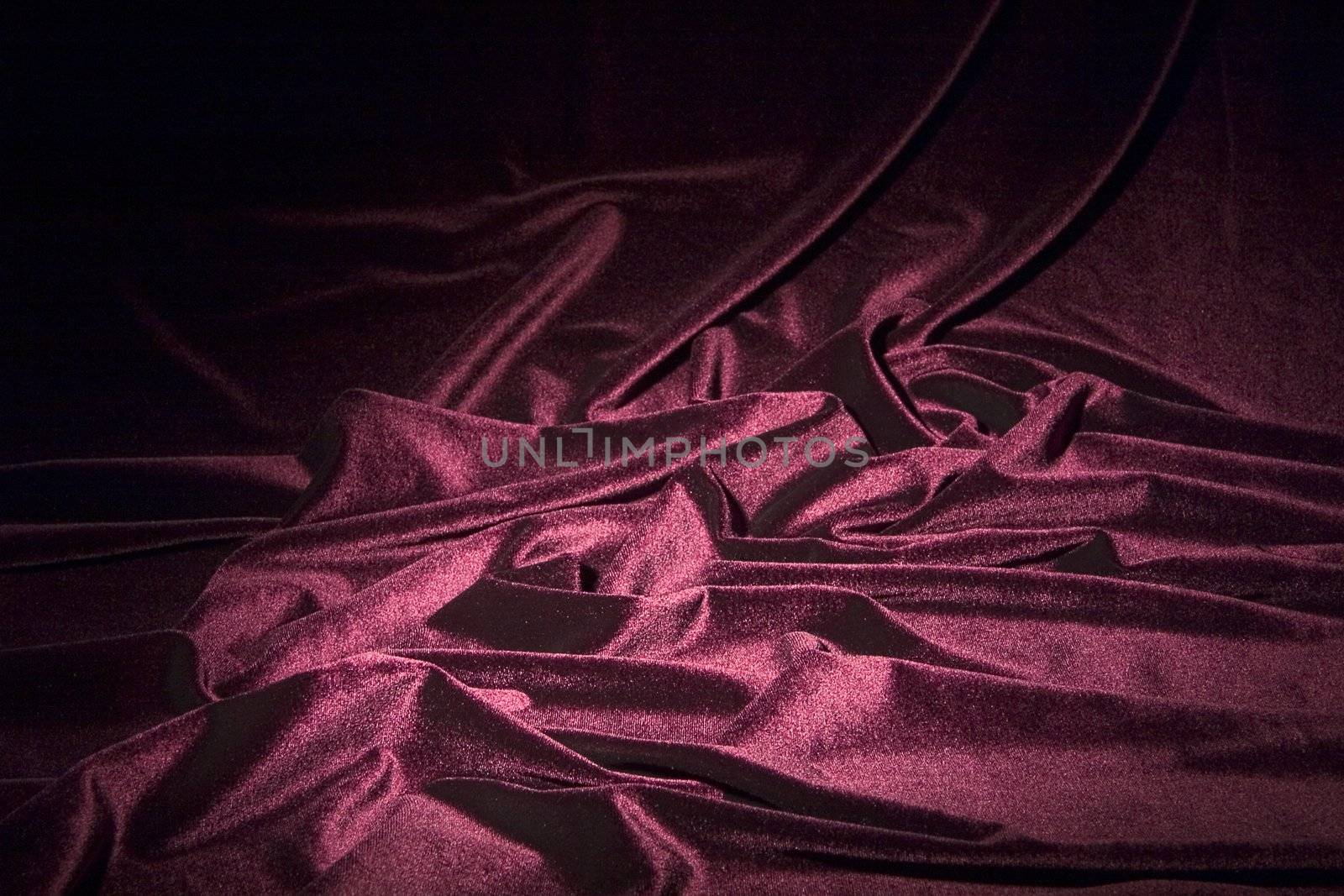 darkly-red glossy velvet is formative folds and light-shadow picture
