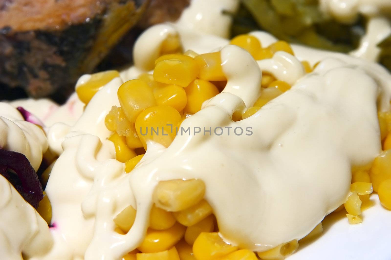 close-up of corn, covered mayonnaise and ready to the use as a meal