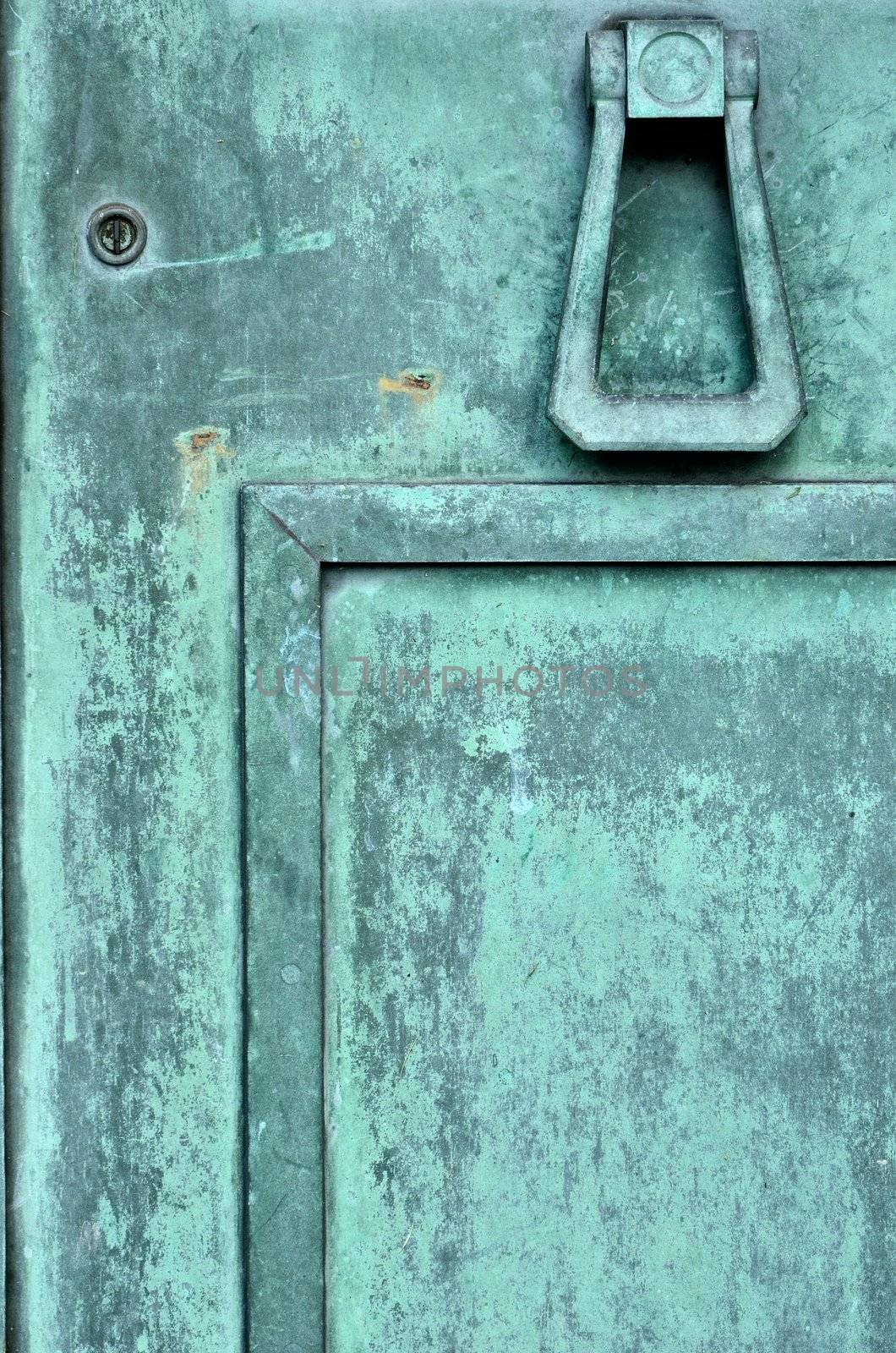 A section of a Tarnished Brass Mausoleum Door.