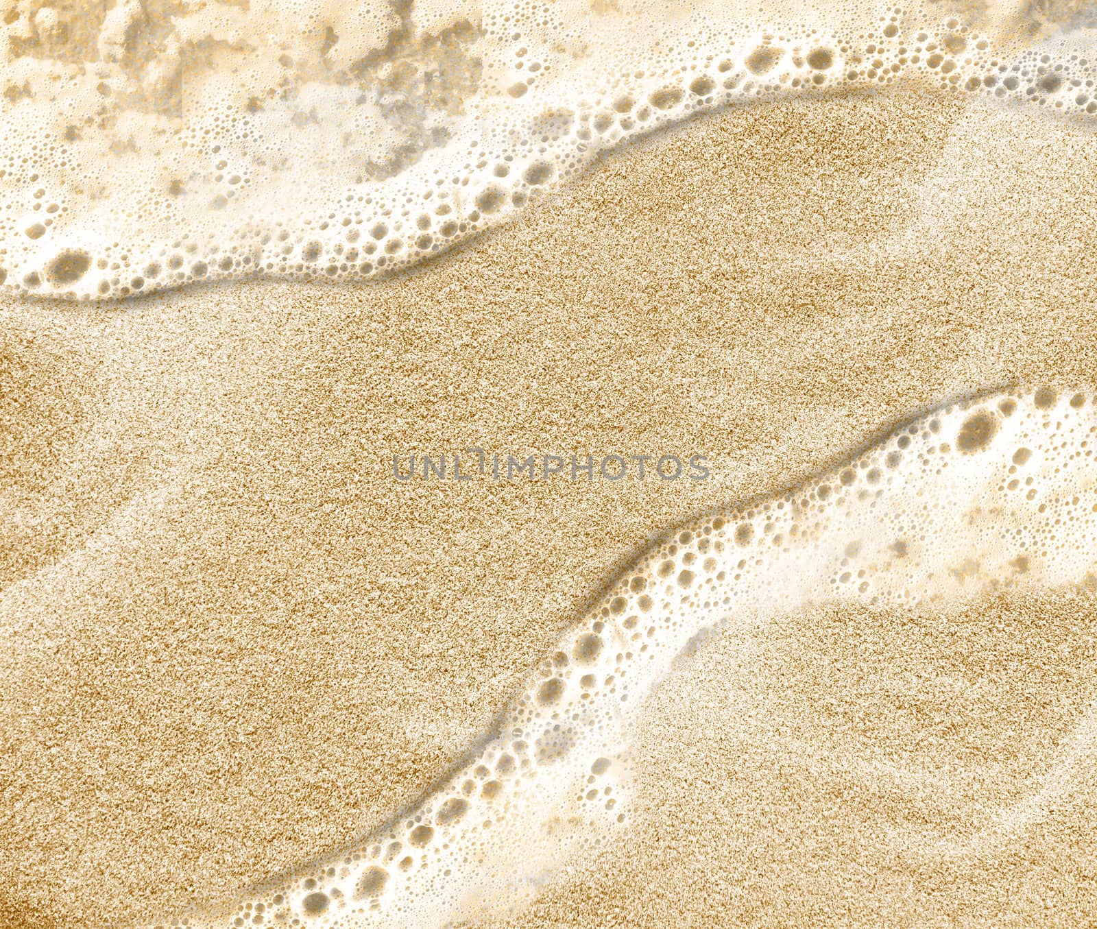 Soft wave of the sea on the clean sandy beach.