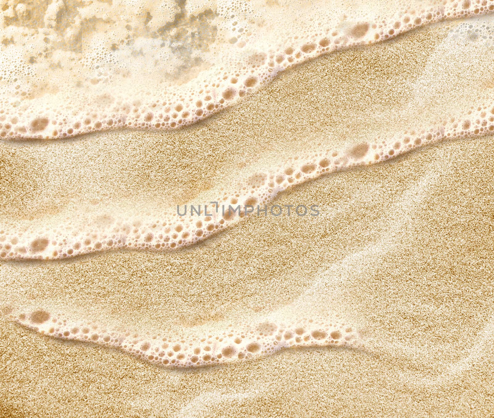 Soft wave of the sea on the clean sandy beach.