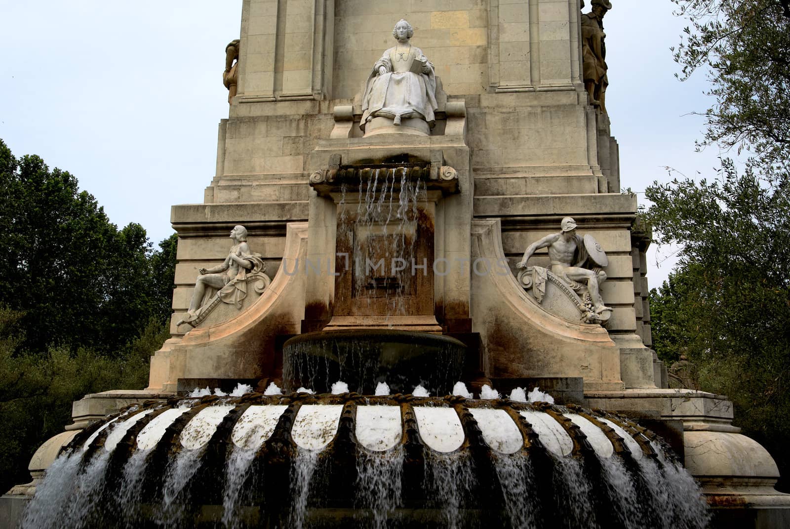 Saved natural parks in Europe trees and statues. Fountain. Madrid