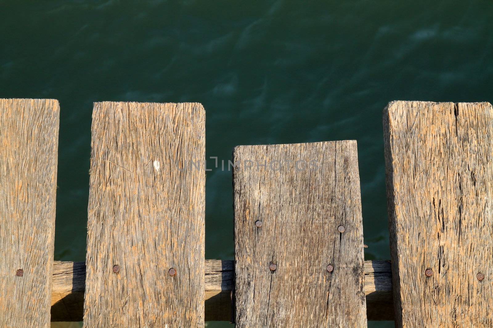 Wooden grunge floor above the river