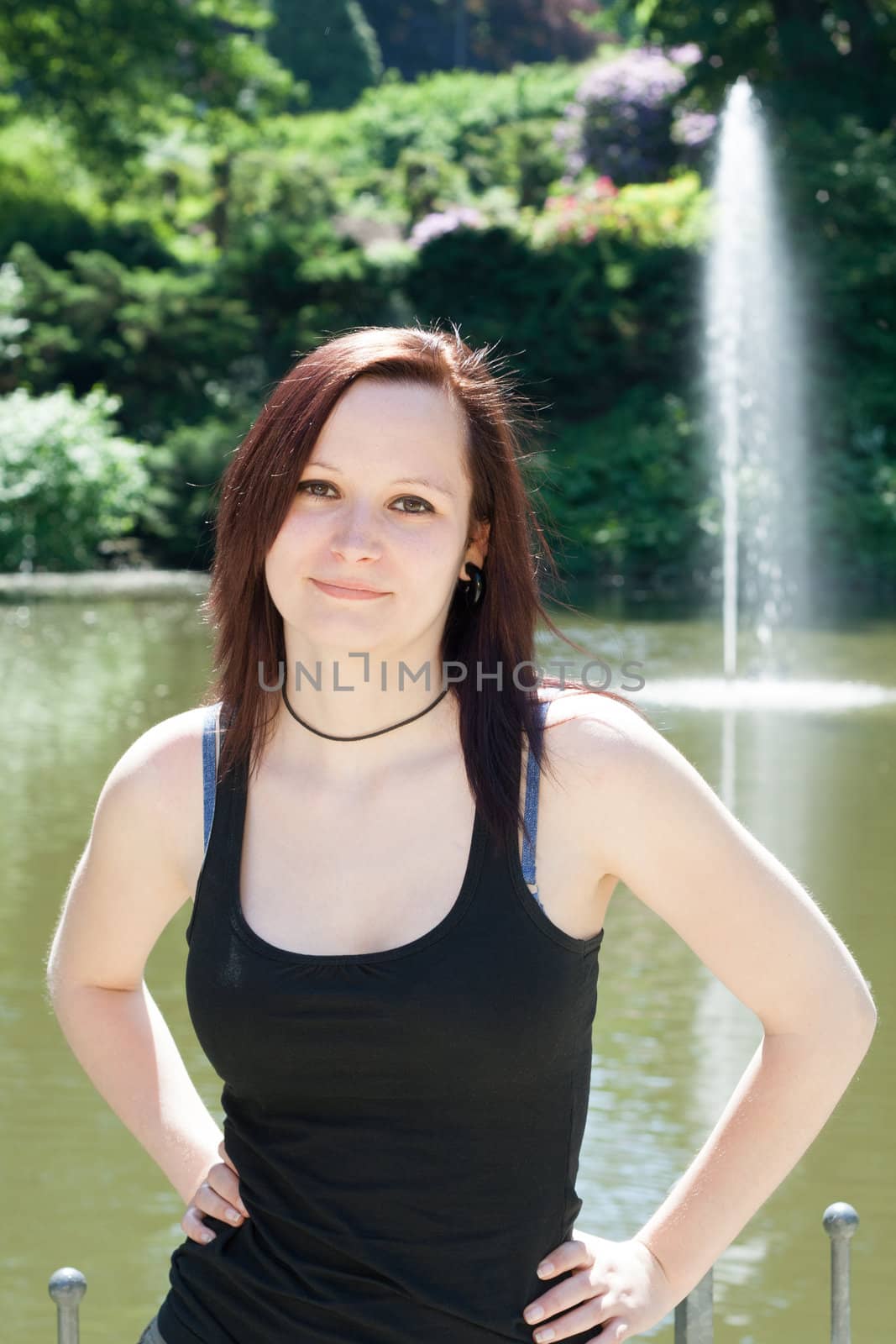 Portrait of an young  Redhead Girl outdoors in a park