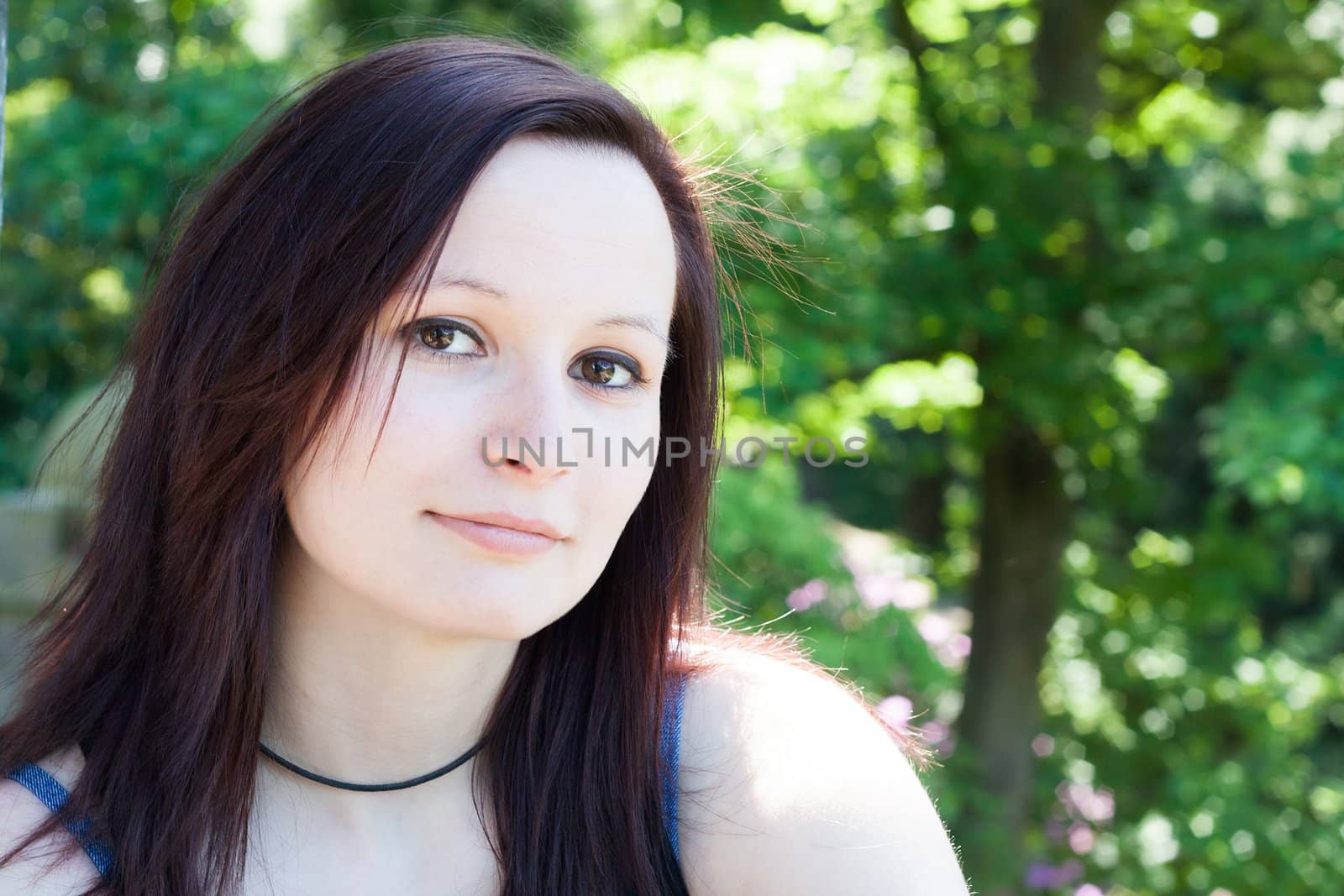 Portrait of an young  Redhead Girl outdoors in a park