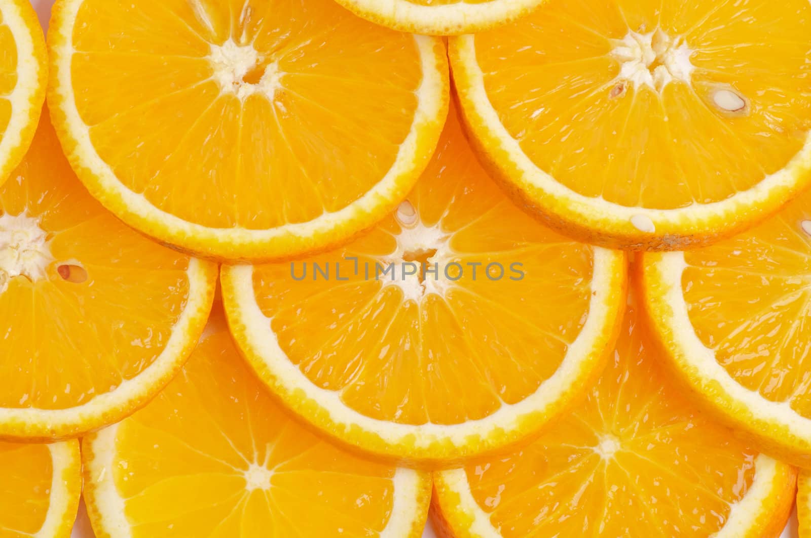 Sliced juicy fresh delicious oranges background closeup