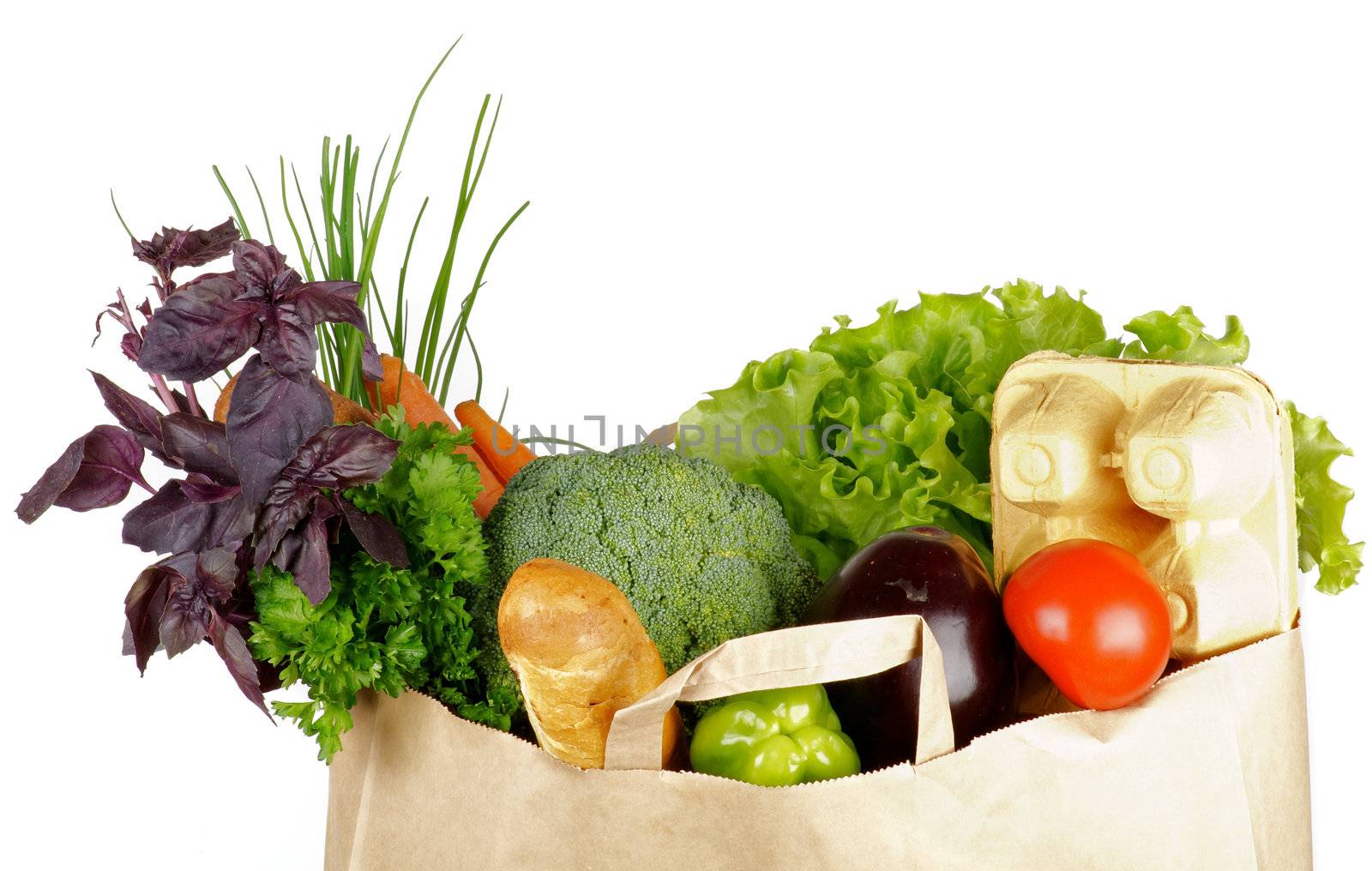 Healthy Eating in Shopping Bag with bread, greens, eggs and fruits isolated on white background