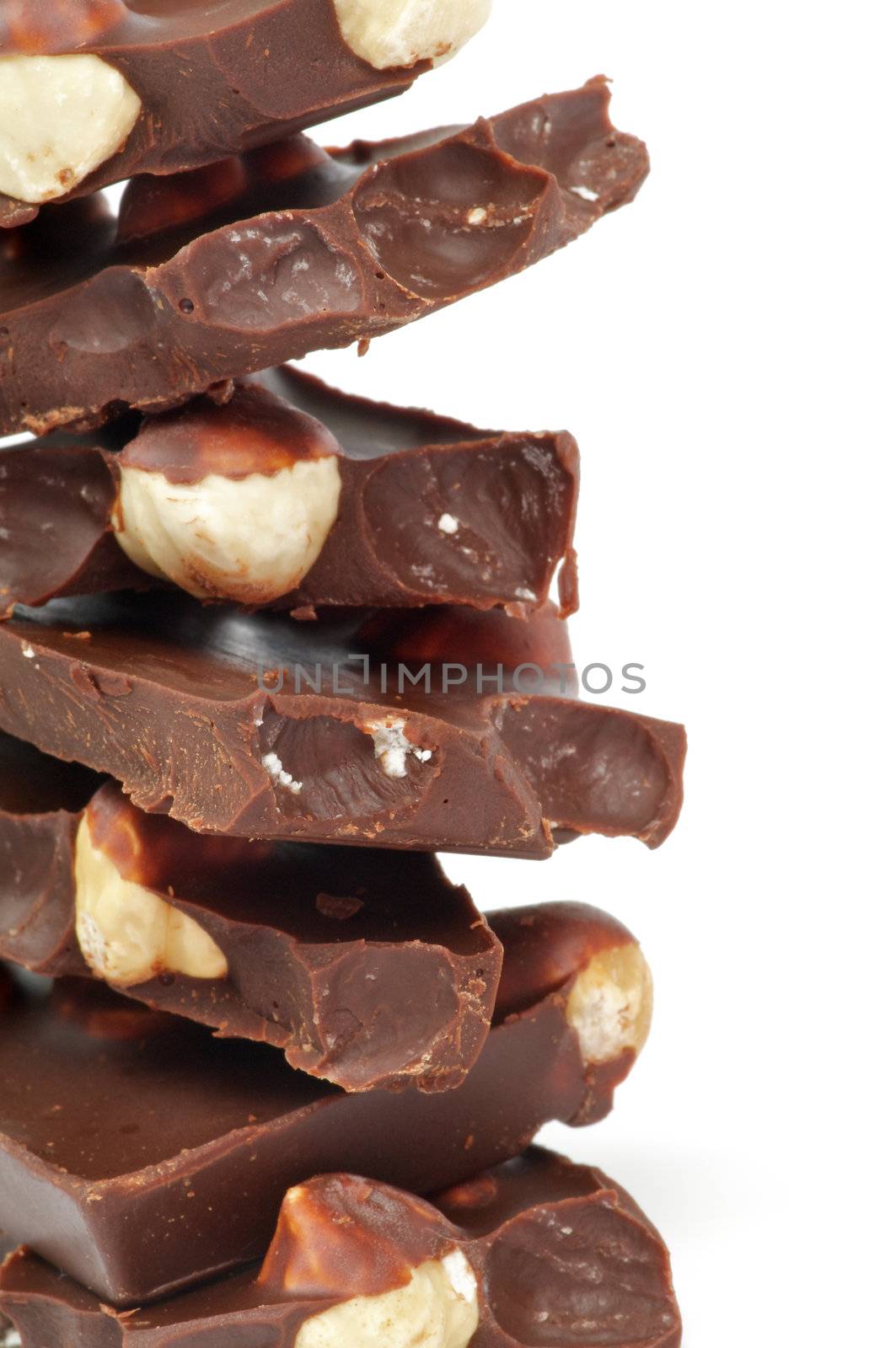Stack of Dark Chocolate with Haselnut isolated on white background