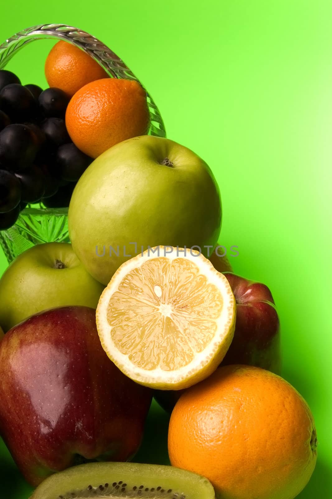 great number of bright and juicy fruit on a green background