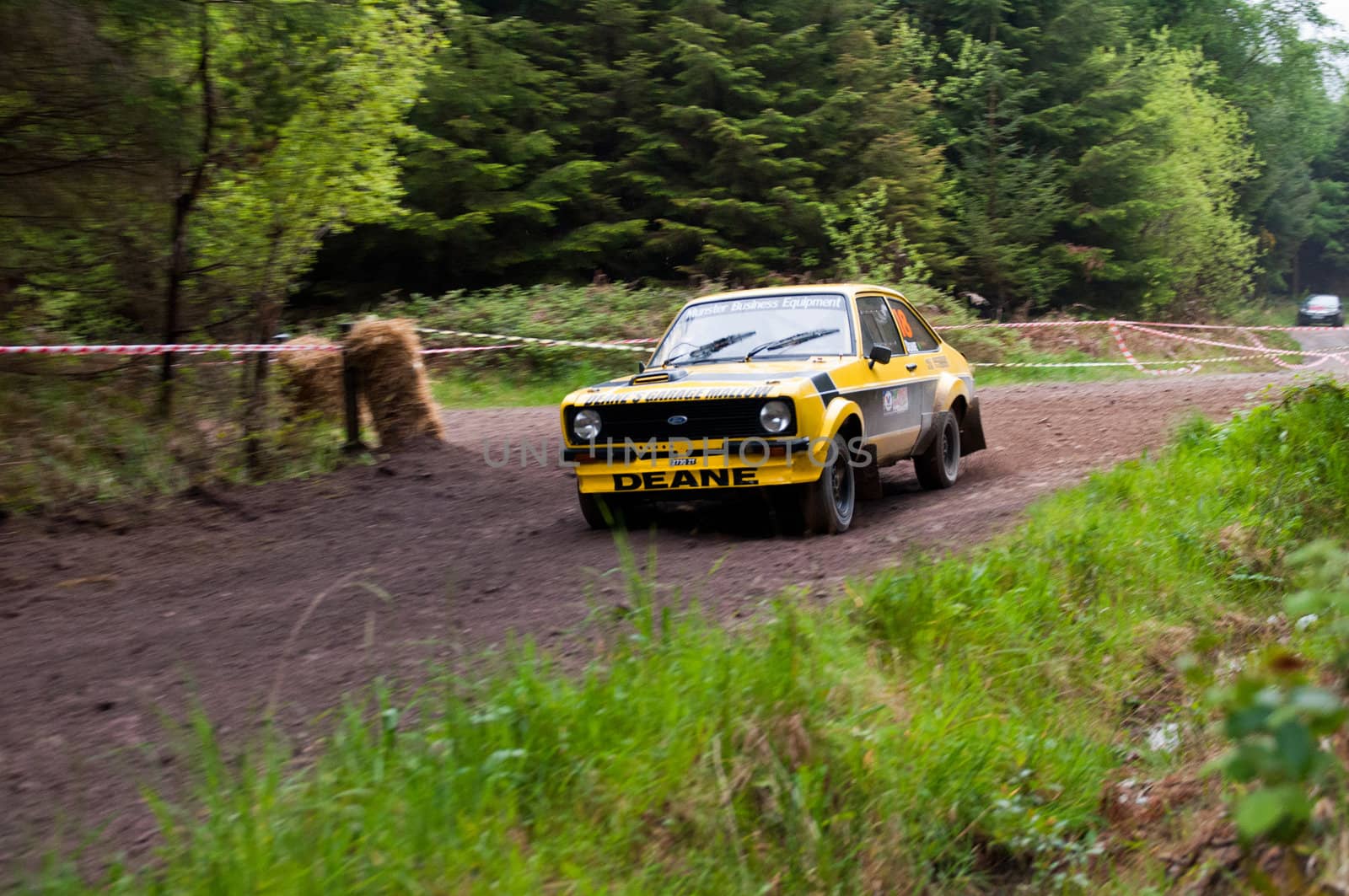 MALLOW, IRELAND - MAY 19: J. Deane driving Ford Escort at the Jim Walsh Cork Forest Rally on May 19, 2012 in Mallow, Ireland. 4th round of the Valvoline National Forest Rally Championship.