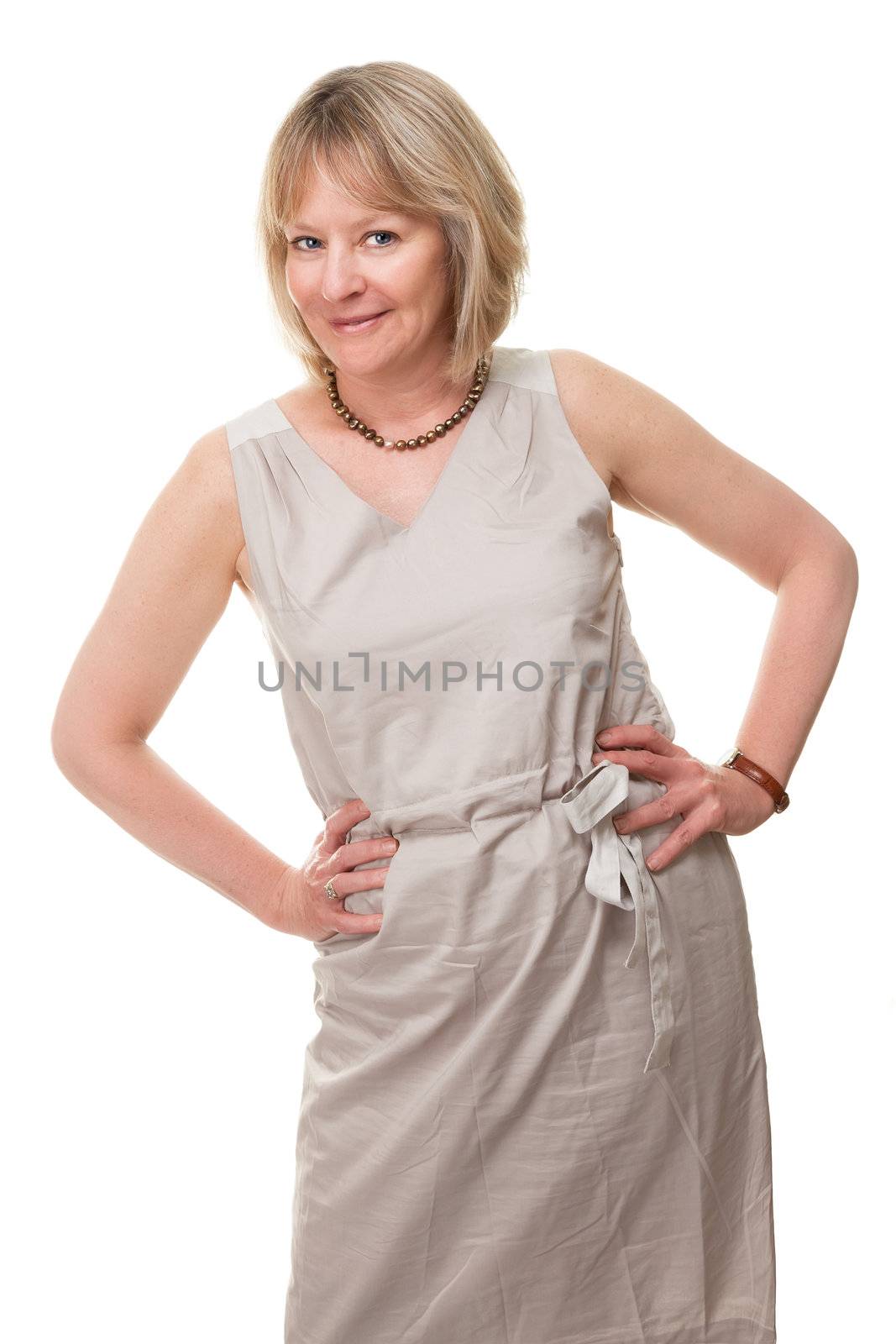 Happy Attractive Mature Woman with Hands on Hip by scheriton
