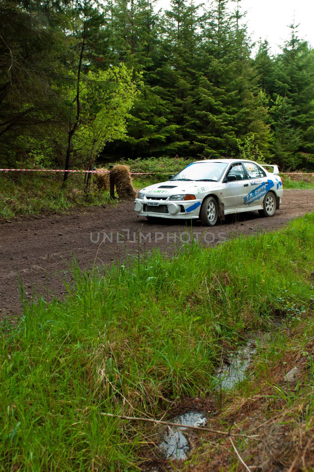 MALLOW, IRELAND - MAY 19: D. Smith driving Mitsubishi Evo at the Jim Walsh Cork Forest Rally on May 19, 2012 in Mallow, Ireland. 4th round of the Valvoline National Forest Rally Championship.