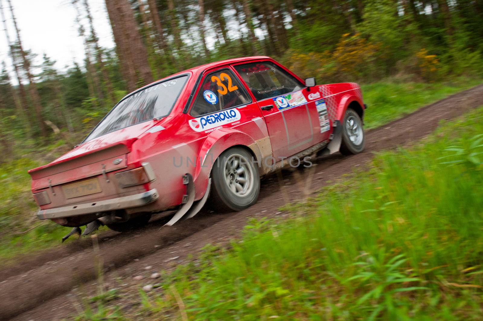 MALLOW, IRELAND - MAY 19: A. Commins driving Ford Escort at the Jim Walsh Cork Forest Rally on May 19, 2012 in Mallow, Ireland. 4th round of the Valvoline National Forest Rally Championship.