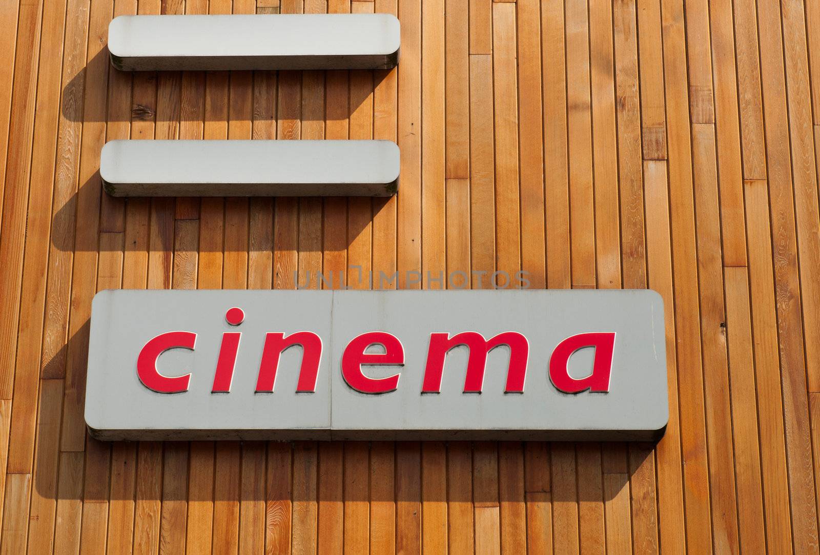 exterior cinema sign on a wooden background