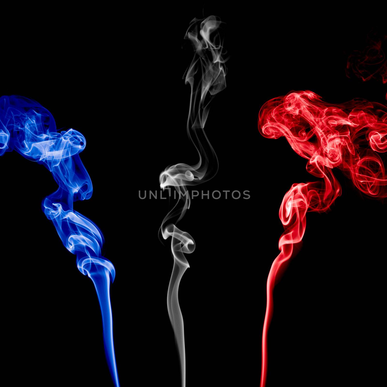 Three Colorful Smoke on black background.