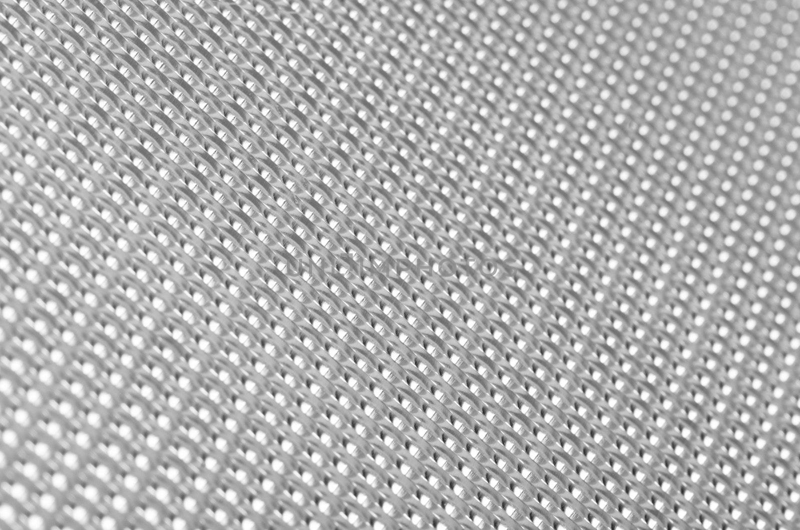 Metal mesh plating isolated against a white background
