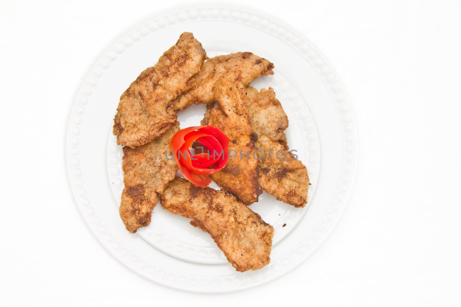 Fried Fish Fillet decorated with tomato pealing