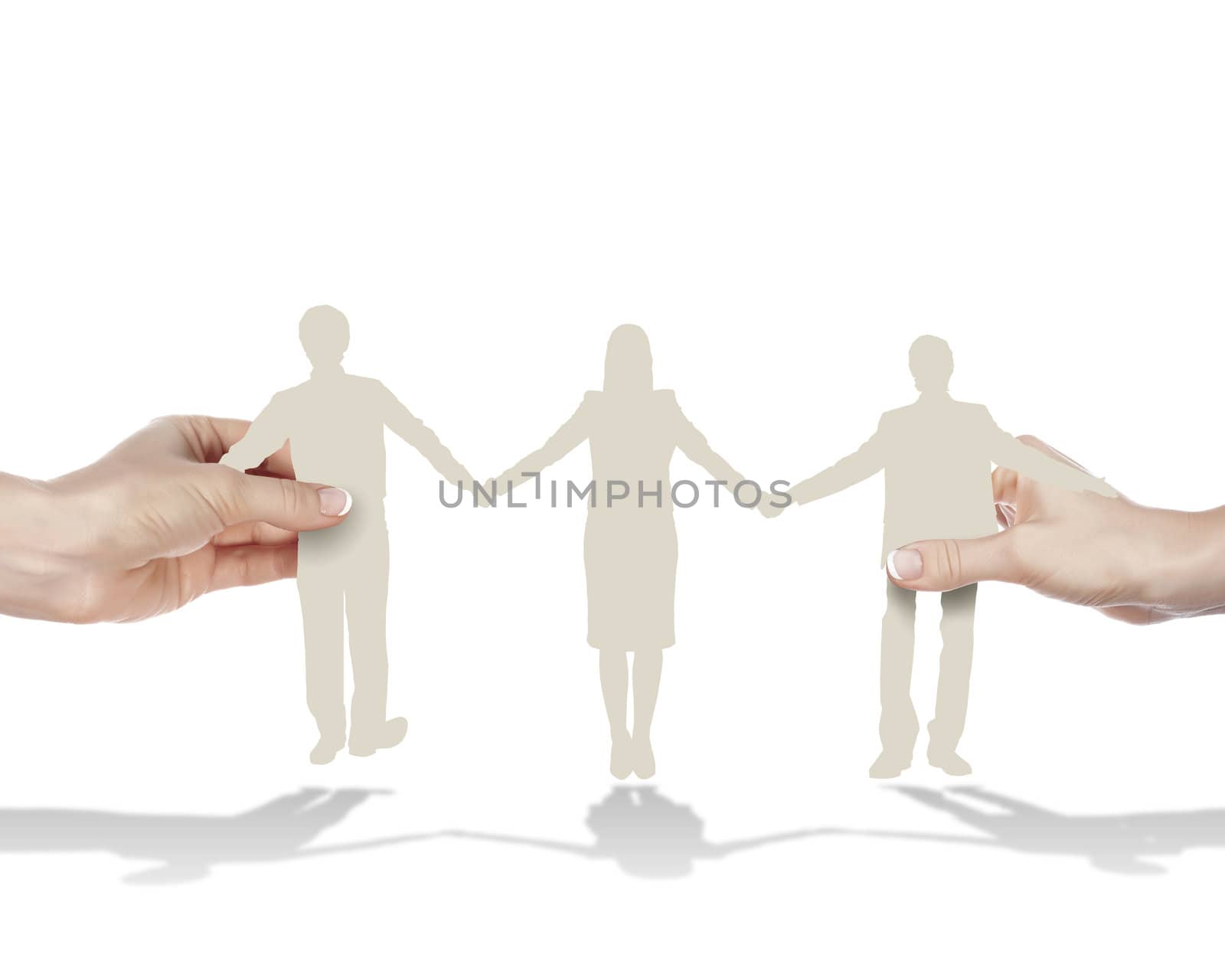 Group of three people standing and holding hands