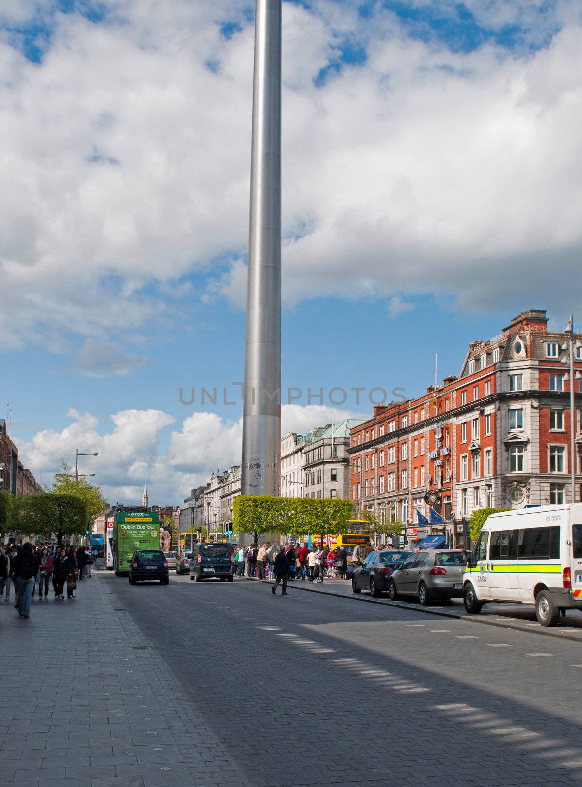 DUBLIN, IRELAND - MAY 12: tourists visiting The Spire of Dublin at the famous O'Connell street on May 12, 2012 in Dublin, Ireland. It has 121.2 metres and costs 4 Million Euros.