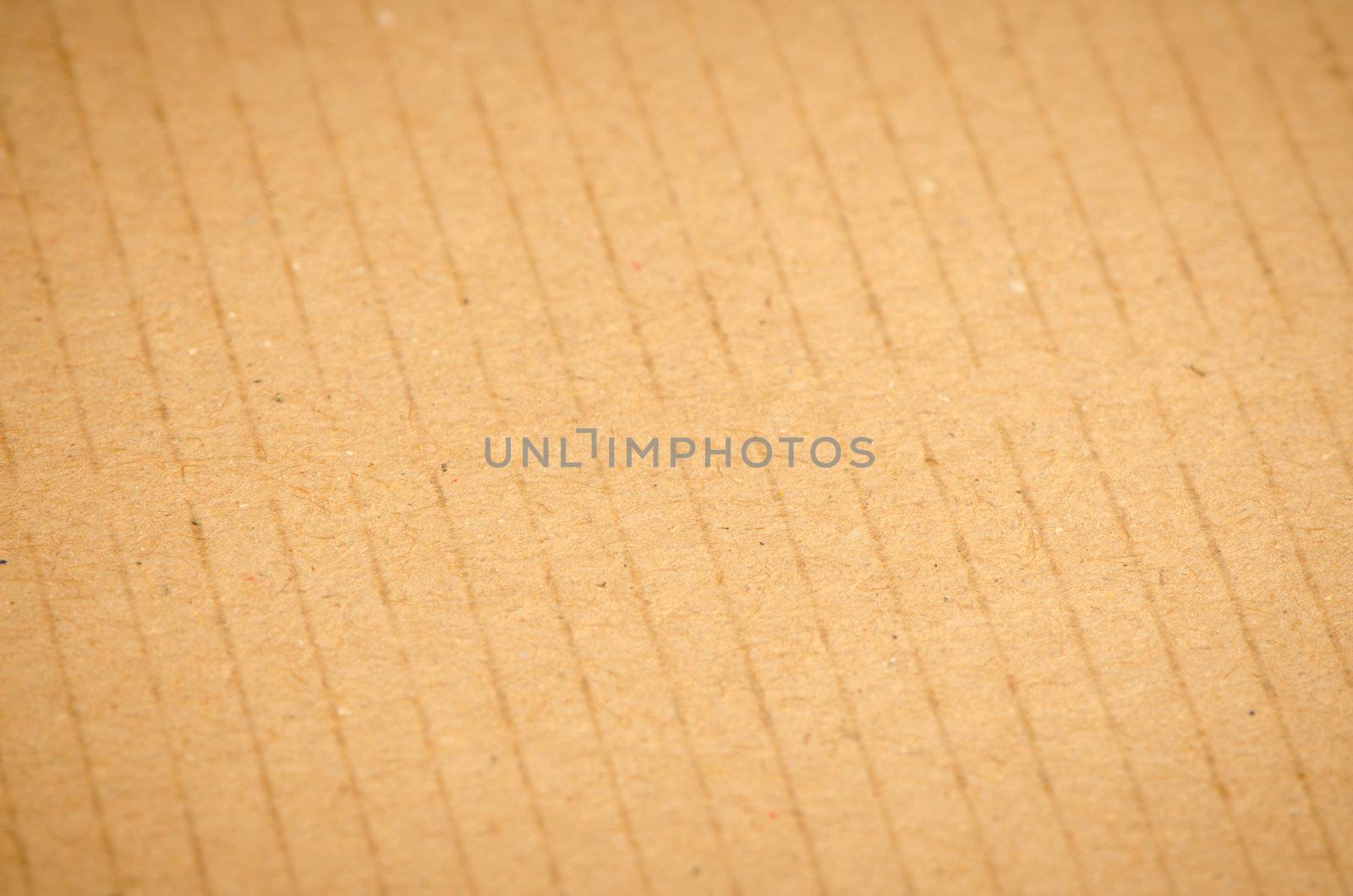 Closeup of textured recycled cardboard with natural fiber parts