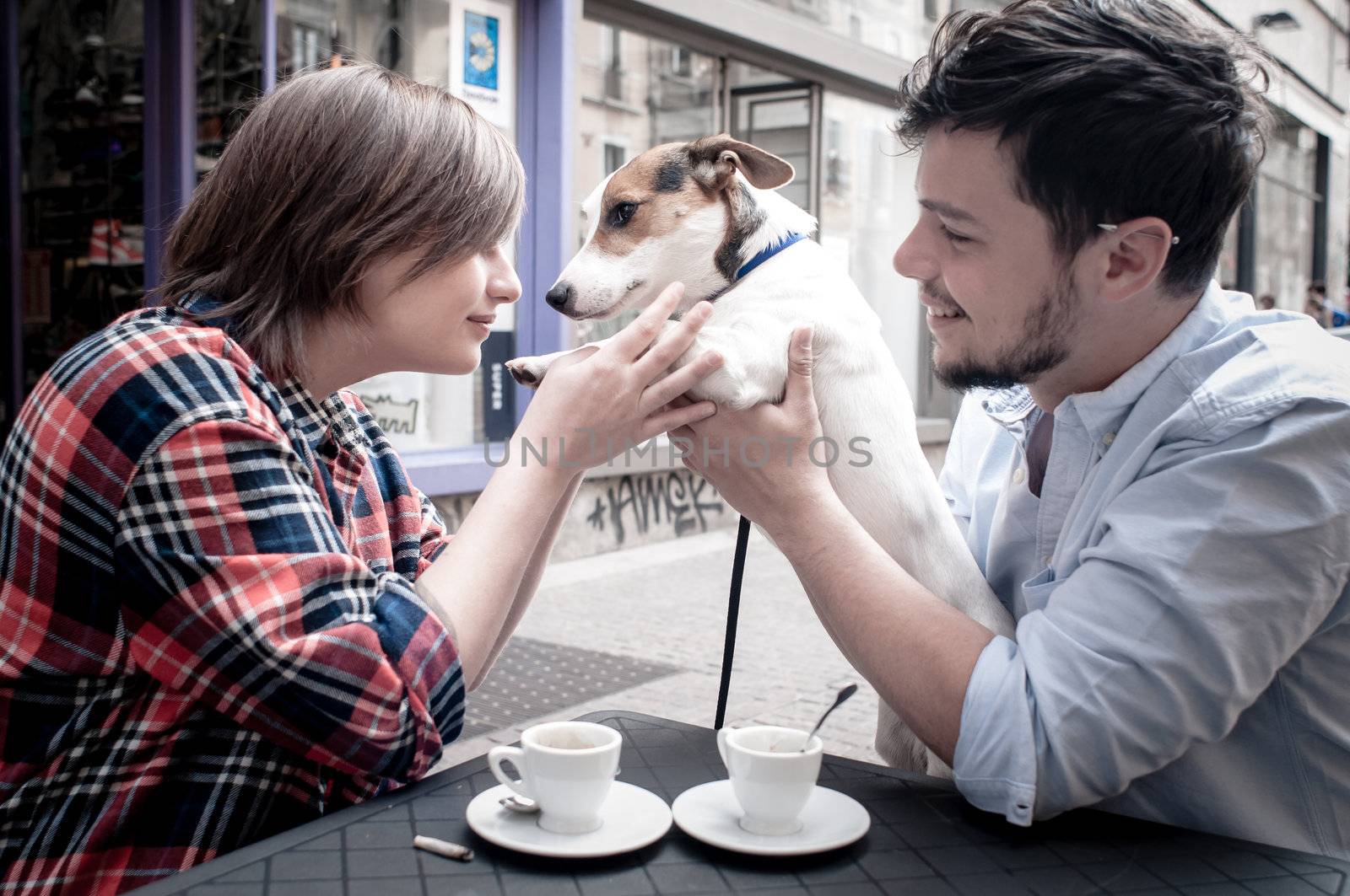 couple at the bar with jack russell by peus