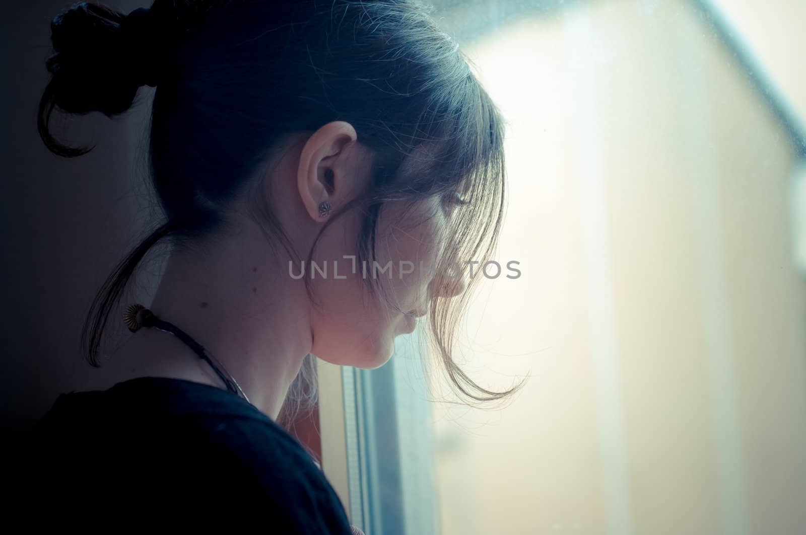 beautiful woman at home near window